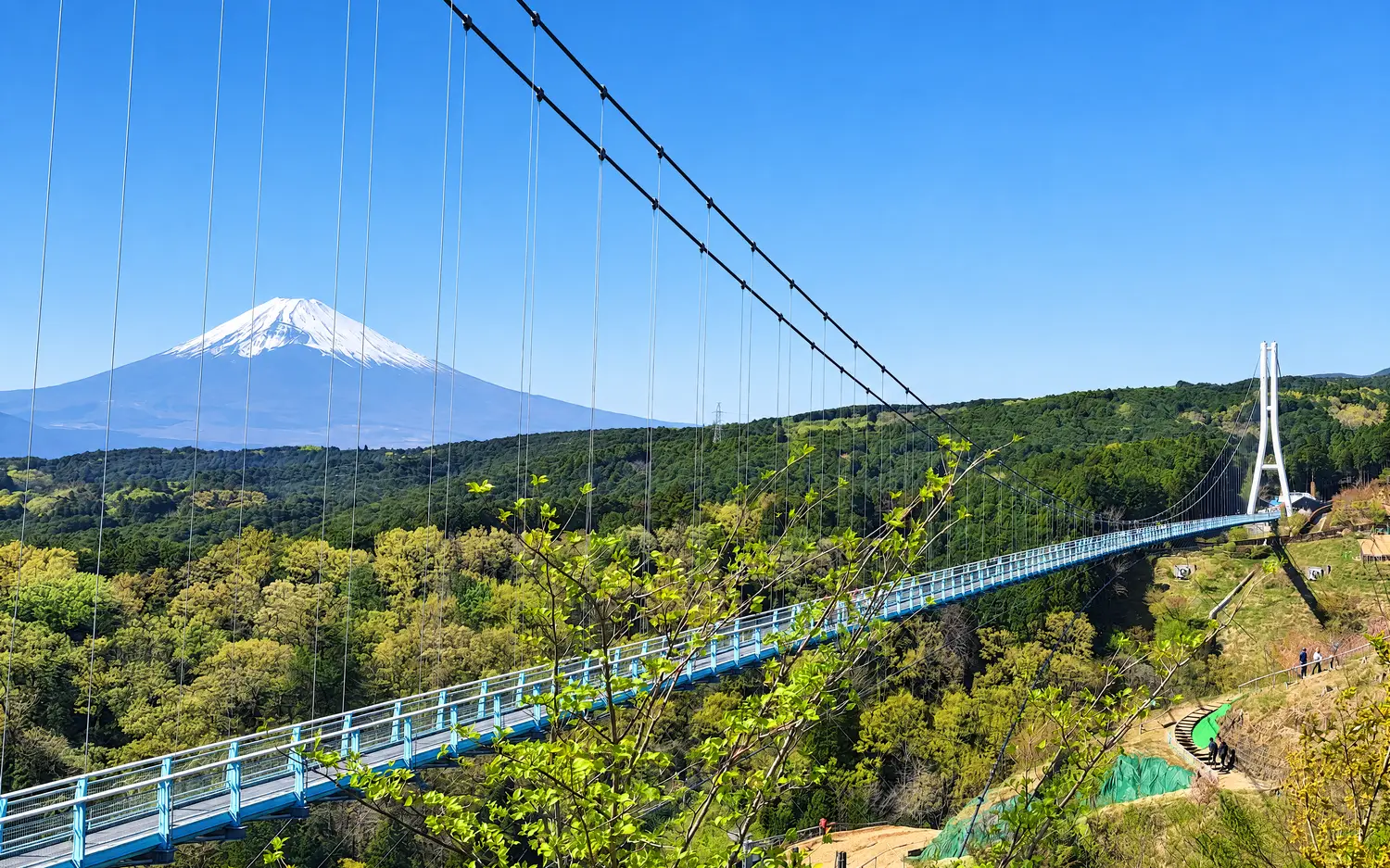 The Mishima Skywalk suspension bridge with Mount Fuji behind it