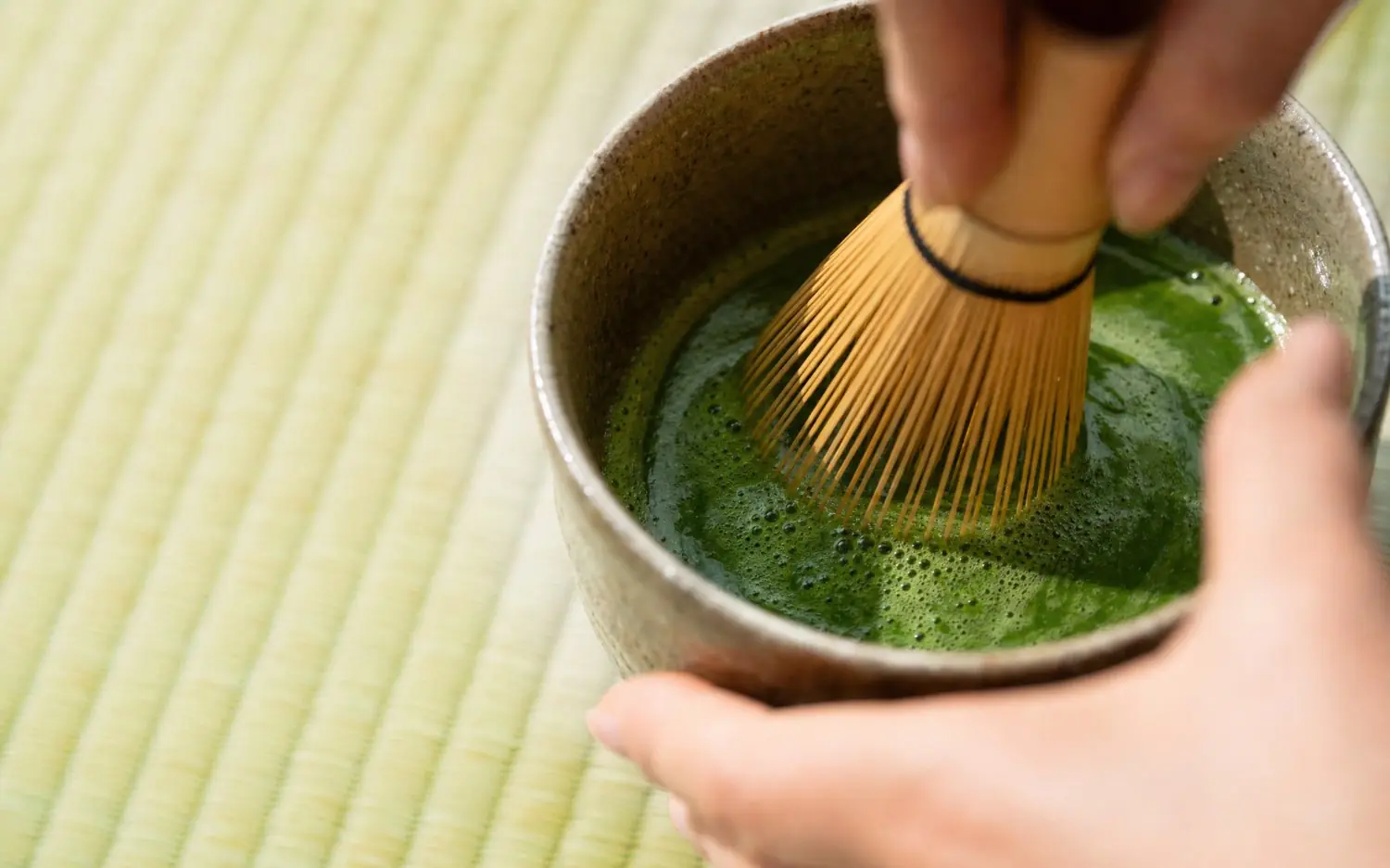 Whisking matcha on tatami